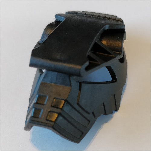 Close-up of a black LEGO Bionicle head (Toa Hordika Whenua), showing its angular shape and textured details.