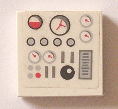 White LEGO 2x2 tile with a sticker featuring a control panel design: red and gray gauges, buttons, and a black knob.