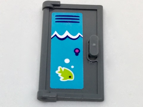 Dark gray LEGO 1x2x3 door with vertical handle and blue sticker featuring white waves, a purple element, and a lime green fish.