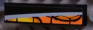LEGO 61678pb049L curved slope with a yellow-to-orange snakeskin pattern and a silver line on a black background.