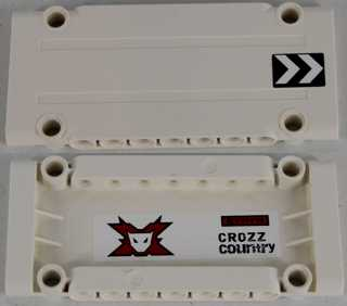 Two white LEGO Technic panel plates. One shows the outside with black and white chevrons, the other shows the inside with a red Team Extreme logo and 'CROZZ COUNTRY' sticker.