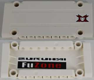 White LEGO Technic Panel Plate 5x11x1. Outside has a red Team Extreme logo. Inside shows a black and red 'FuZone' pattern.