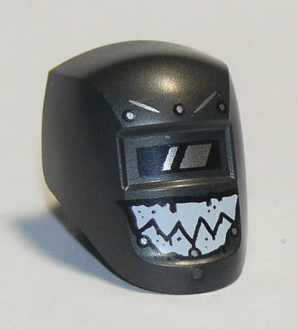 Dark grey LEGO welding visor with black and white viewing lens, angry eye markings, and white jagged teeth pattern.