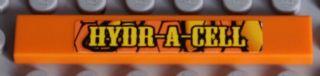 LEGO 6636pb061 orange 1x6 tile with 'HYDR-A-CELL' yellow pattern sticker, on a gray studded background.