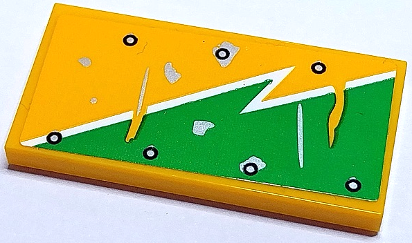 LEGO 2x4 yellow tile with a bright green section, white worn lightning bolt line, silver scuffs, and black circular markings.