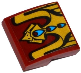 LEGO 15068pb072 red curved 2x2x2/3 slope with a gold abstract bird/dragon pattern, blue eyes, and red markings.