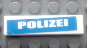 LEGO 2431pb0543 white 1x4 tile with 'POLIZEI' in white letters on a blue sticker, on a grey studded LEGO background.
