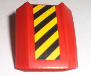 A red LEGO curved 2x2 slope piece featuring a black and yellow diagonal danger stripe pattern on the surface.