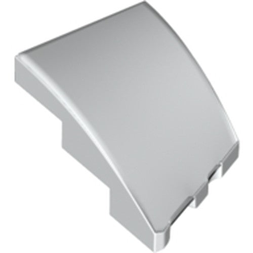 Close-up of a silver LEGO 3x2 left wedge with a smooth, curved top surface and no studs.