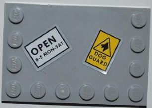 Grey LEGO 4x6 modified tile with studs on edges, featuring 'OPEN 8-5 MON-SAT' and 'DOG GUARD' stickers.