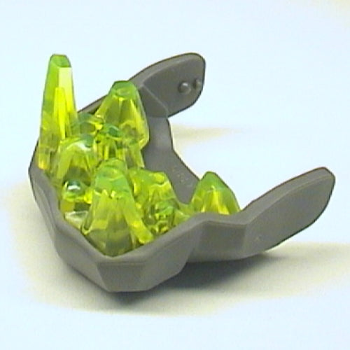 Dark gray LEGO Rock Monster King lower jaw piece with translucent neon green crystal teeth inside, on a white background.