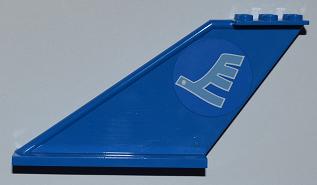 Blue LEGO Tail 12 x 2 x 5 (part 87614pb002) with a light blue circular sticker featuring an airline bird/E logo.