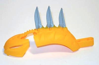 Yellow LEGO Bionicle Rahkshi back cover with three pearl light gray blades and a detached mask piece.