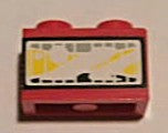 LEGO 3004pb094 red 1x2 headlight brick with a white sticker featuring a yellow control panel pattern.