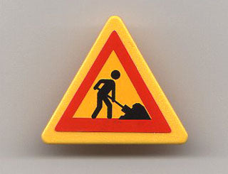 Yellow LEGO road sign 2x2 triangle with red border and black worker digging a pile of dirt sticker, from Set 7905.