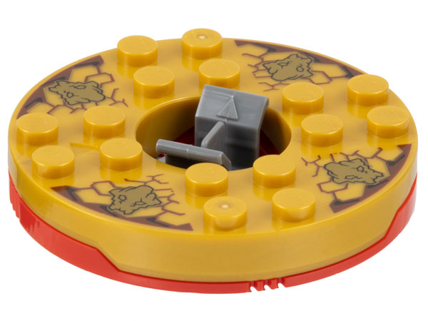 LEGO Ninjago Spinner turntable with pearl gold top, gold faces on reddish-brown pattern, and red base.