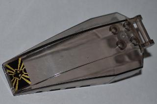 Dark gray transparent LEGO windscreen 8x4x2 with 4 studs, bar handle, and black & yellow snake skull sticker.