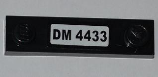 Black LEGO 1x4 modified plate with 2 studs, featuring a white 'DM 4433' sticker, part of set 4433.