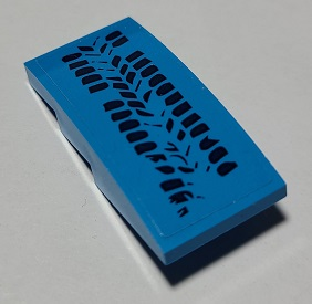 Blue LEGO Slope, Curved 4 x 2 piece, part 93606pb131, with a black tire tracks pattern on its top surface.