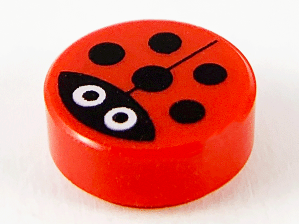 Red LEGO round 1x1 tile featuring a ladybug pattern with black spots, a black head, and two large white eyes.