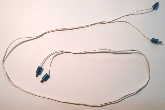 LEGO 4.5V electric wire with four blue 1-prong hollow pin connectors, laid out on a white background.