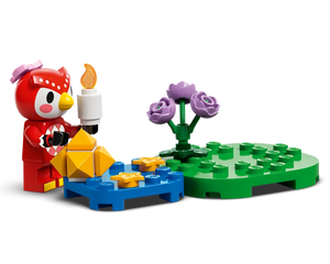 LEGO Animal Crossing Celeste owl figure holds a candle, near a blue base with stars and gold pieces, beside a green base with purple roses.