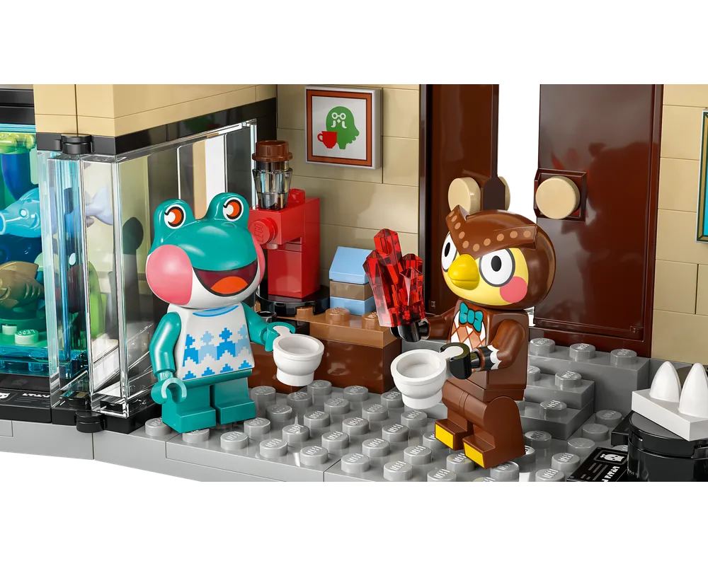LEGO Animal Crossing 77056 set: Frobert and Blathers minifigures hold cups, Blathers also holds crystals, inside a museum display.