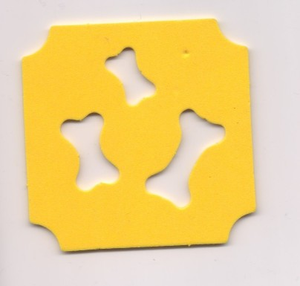 Yellow foam mat with three bone-shaped cutouts and decoratively notched corners.