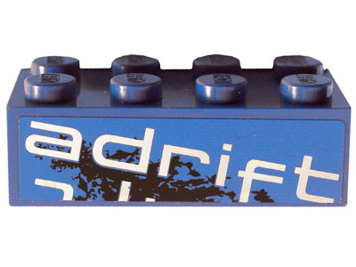 Blue LEGO 2x4 brick with 'adrift' text in white and a black abstract design on its side. Part 3001pb096R, Set 8151.