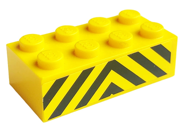 Yellow LEGO 2x4 brick with black danger stripes pattern on its side, from LEGO Set 7743.