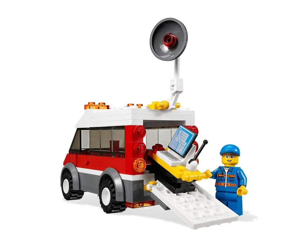 LEGO City 3366 Satellite Launch Pad set featuring a red and white service van with a satellite dish, a minifigure, and a mobile computer.