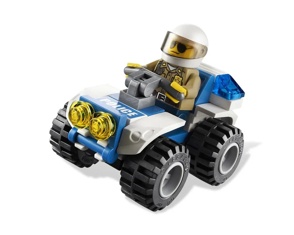 LEGO City 4437 Police Pursuit ATV, white and blue, driven by a police minifigure in a white helmet, with yellow headlights and blue siren.