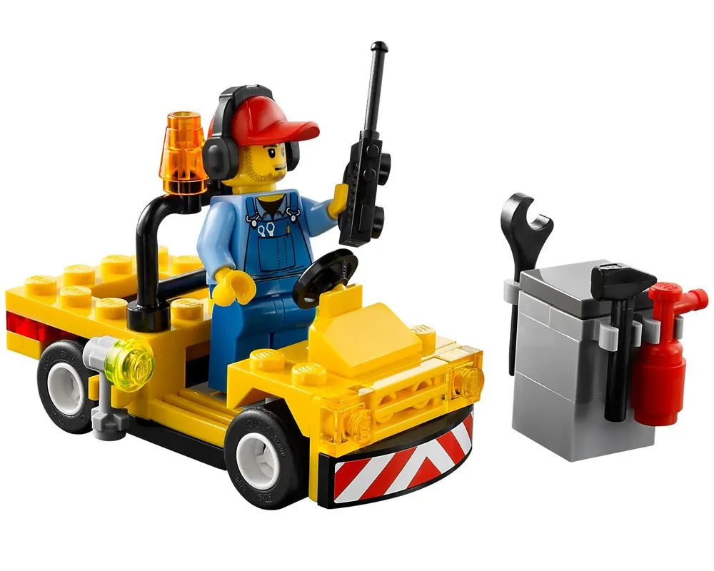 LEGO City 60019 airport ground crew minifigure in yellow service vehicle with radio, headset, tools, and cabinet.