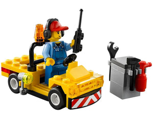 LEGO City 60019 airport ground crew minifigure in yellow service vehicle with radio, headset, tools, and cabinet.