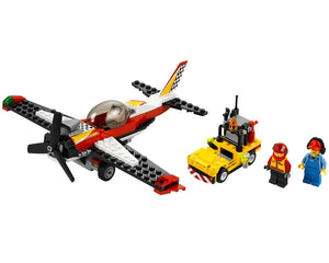LEGO City 60019 Stunt Plane set with red and white stunt plane, yellow ground vehicle, and two minifigures on white.