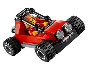 LEGO City 60173 Mountain Arrest red buggy with a female minifigure driver, black roll cage, and large knobby tires.