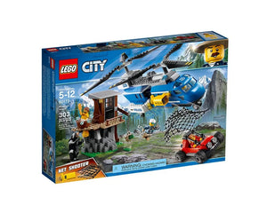 LEGO City 60173 Mountain Arrest set featuring a police helicopter, red buggy, mountain hut, bear, and minifigures.