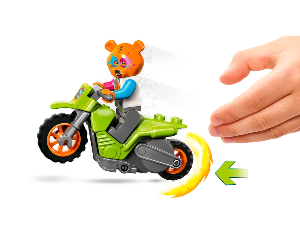 A green LEGO City 60356 Bear Stunt Bike with a bear minifigure, a child's hand, and a pullback motion arrow.