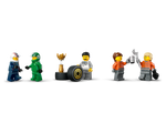 LEGO minifigures: two race drivers, a mechanic with a tire and trophy, and two mechanics toasting with a wrench and mug.