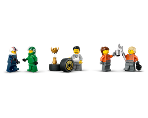 LEGO minifigures: two race drivers, a mechanic with a tire and trophy, and two mechanics toasting with a wrench and mug.