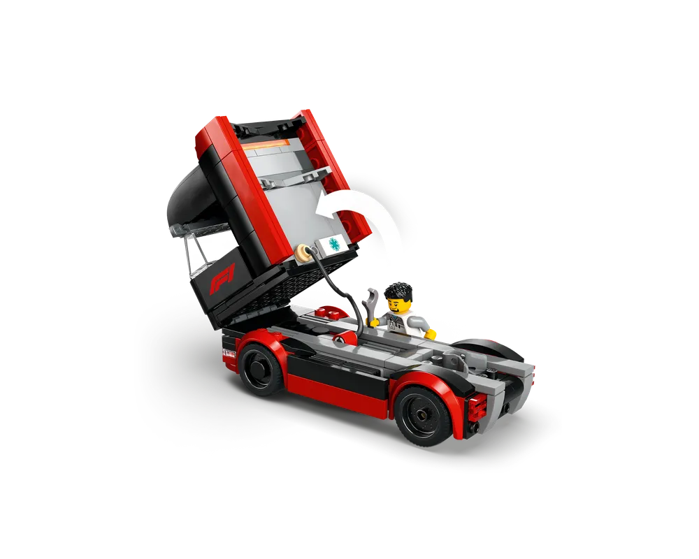 LEGO F1 race truck in red and black with cab tilted up, revealing a driver minifigure holding a wrench.