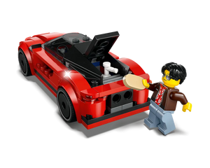 Red LEGO sports car with its engine bay open, and a minifigure in sunglasses holding a part near the engine.