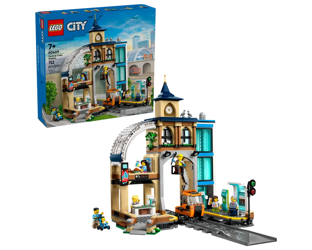 Built LEGO City 60469 Central Train Station set showing a detailed station building, track, and minifigures, with the product box.
