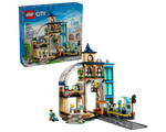 Built LEGO City 60469 Central Train Station set showing a detailed station building, track, and minifigures, with the product box.