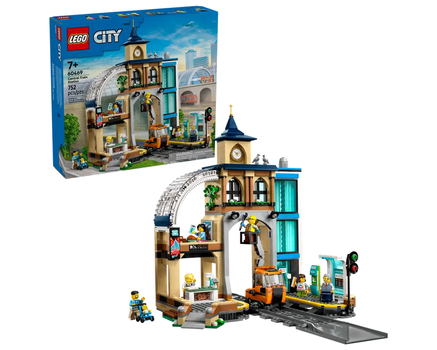 Built LEGO City 60469 Central Train Station set showing a detailed station building, track, and minifigures, with the product box.