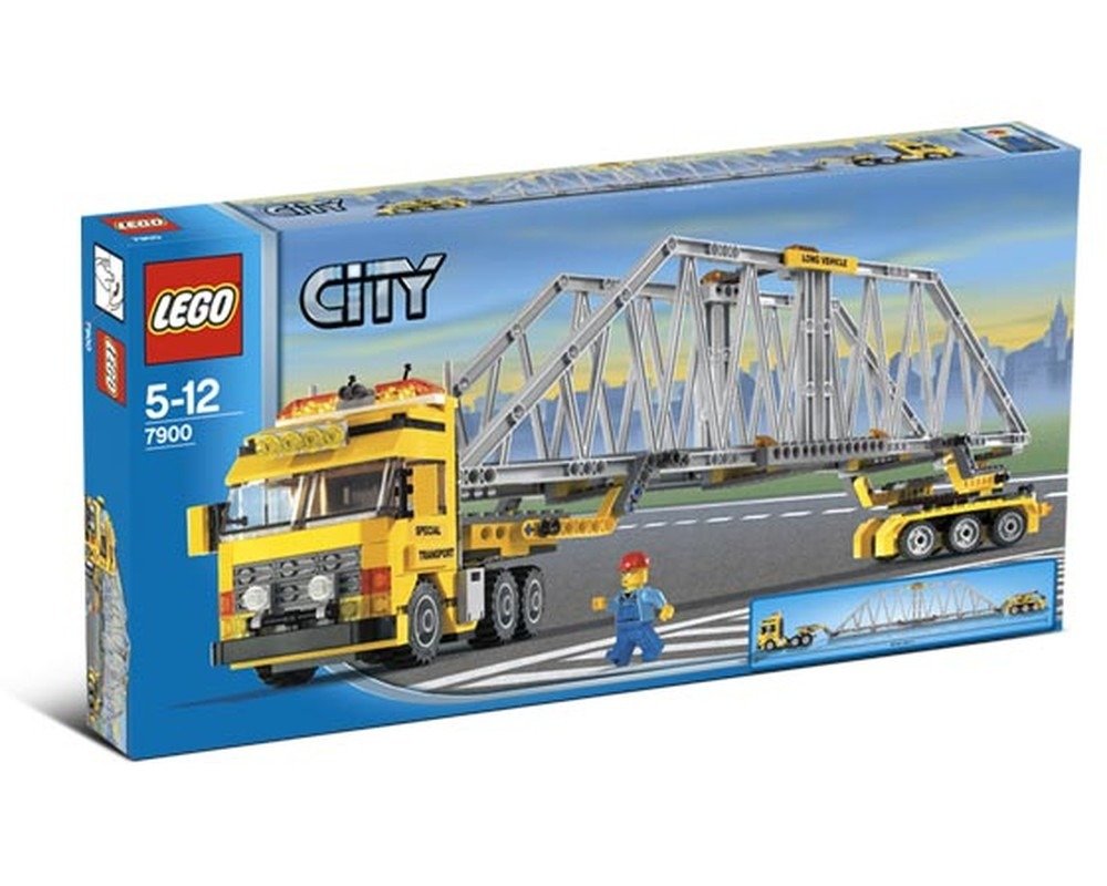 LEGO City 7900 Heavy Loader box showing a yellow truck carrying a long bridge section with a minifigure on the road.
