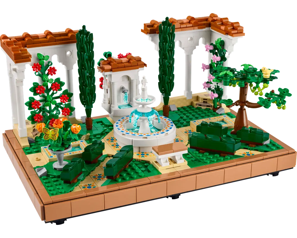 A detailed LEGO Creator 10359 Fountain Garden set featuring a central fountain, arched white pergolas, green plants, and flowers.