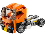 LEGO Creator 31017 orange truck cab and chassis with clear windshield, dark grey wheels, and a black steering wheel.