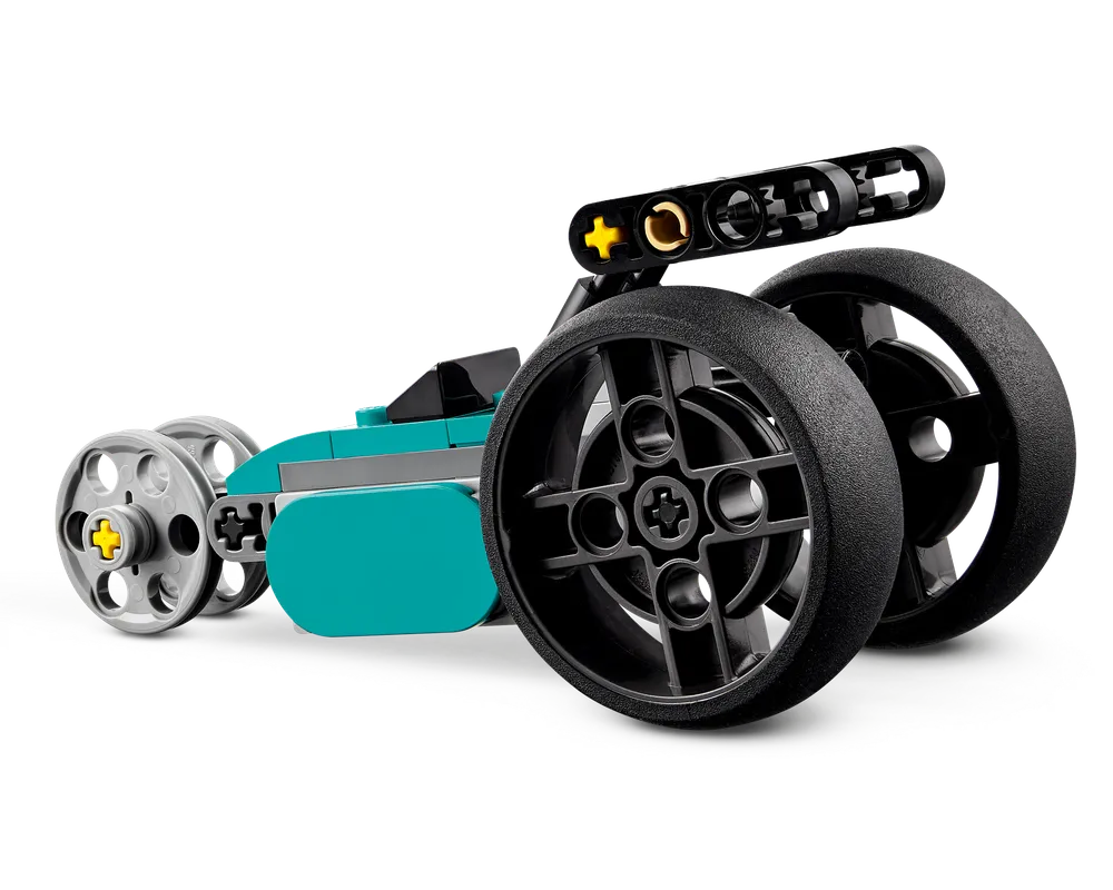 Teal, grey, and black three-wheeled LEGO vehicle, an alternate build from the LEGO Creator 31135 Vintage Motorcycle set.