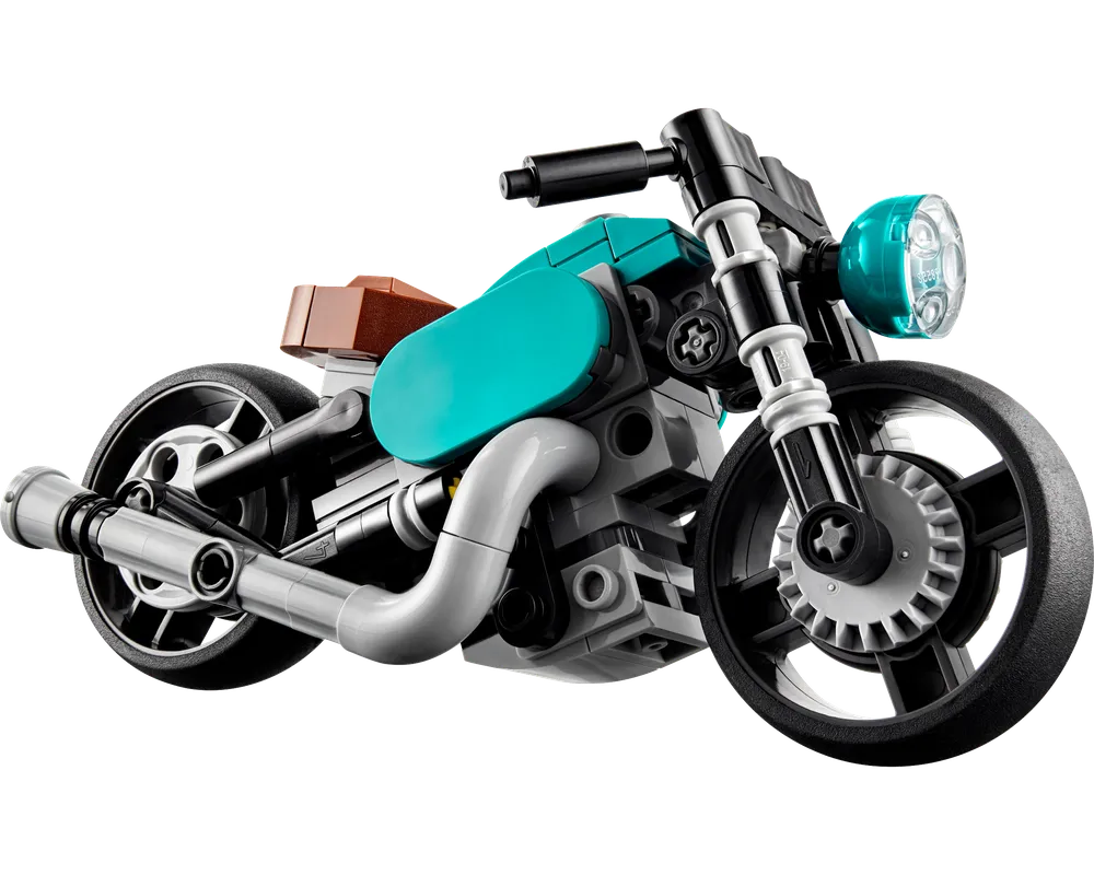 Teal and brown LEGO Creator 31135 Vintage Motorcycle with silver exhaust pipes and black wheels.